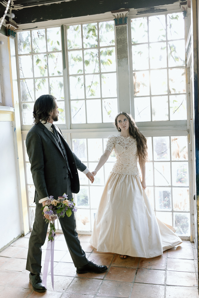 cute picture of the bride and groom holding hands