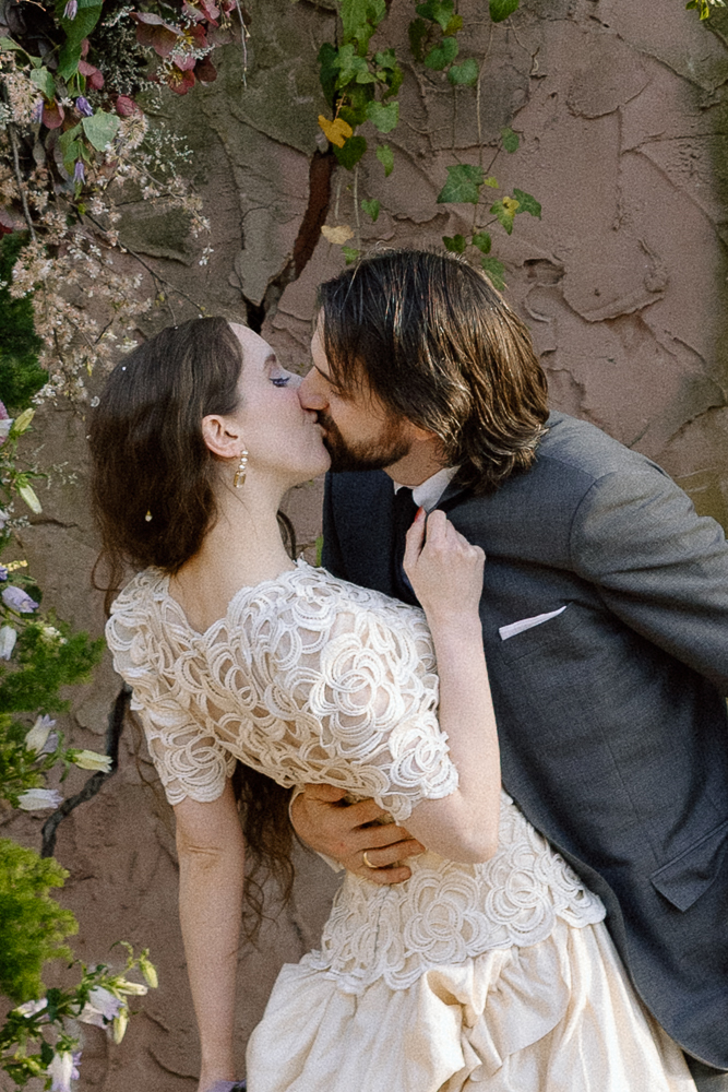 portrait of the newlyweds kissing