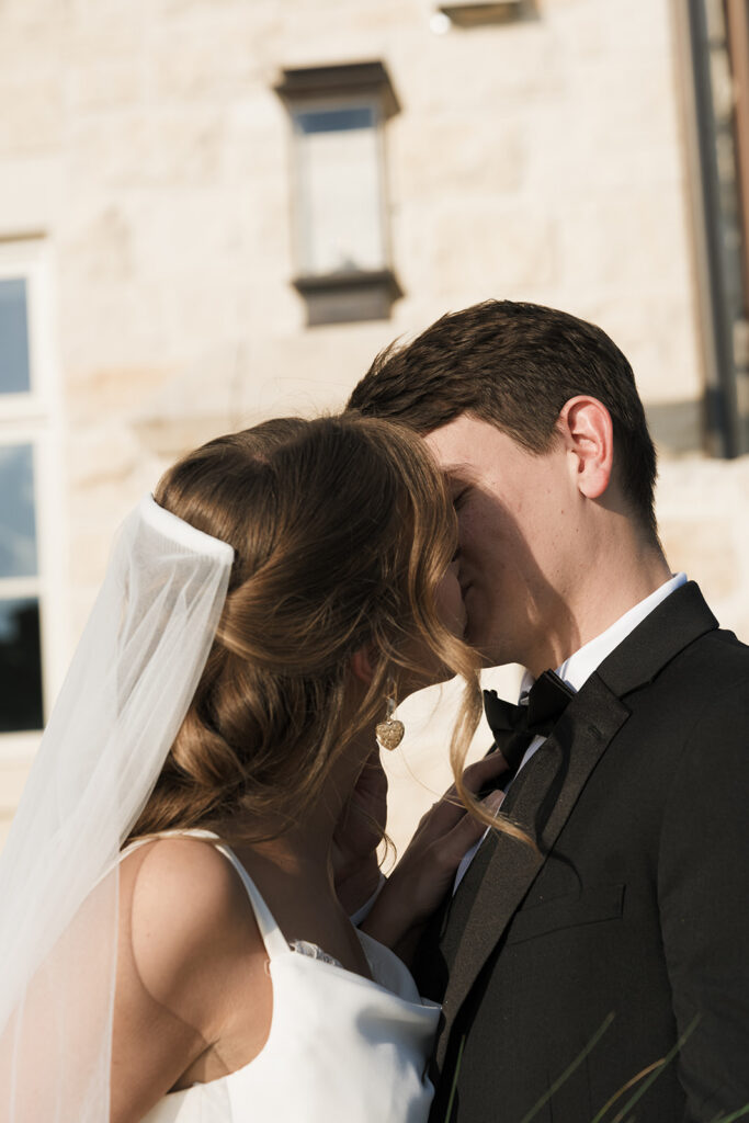 cute picture of the bride and groom kissing