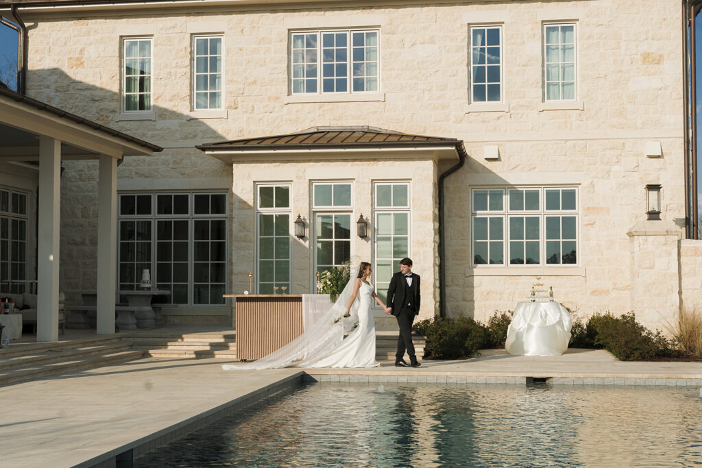cute picture of the bride and groom holding hands