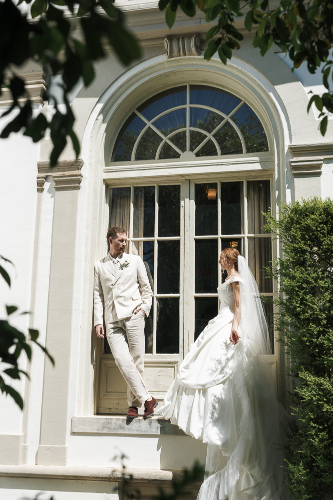 portrait of the bride and groom smiling at each other