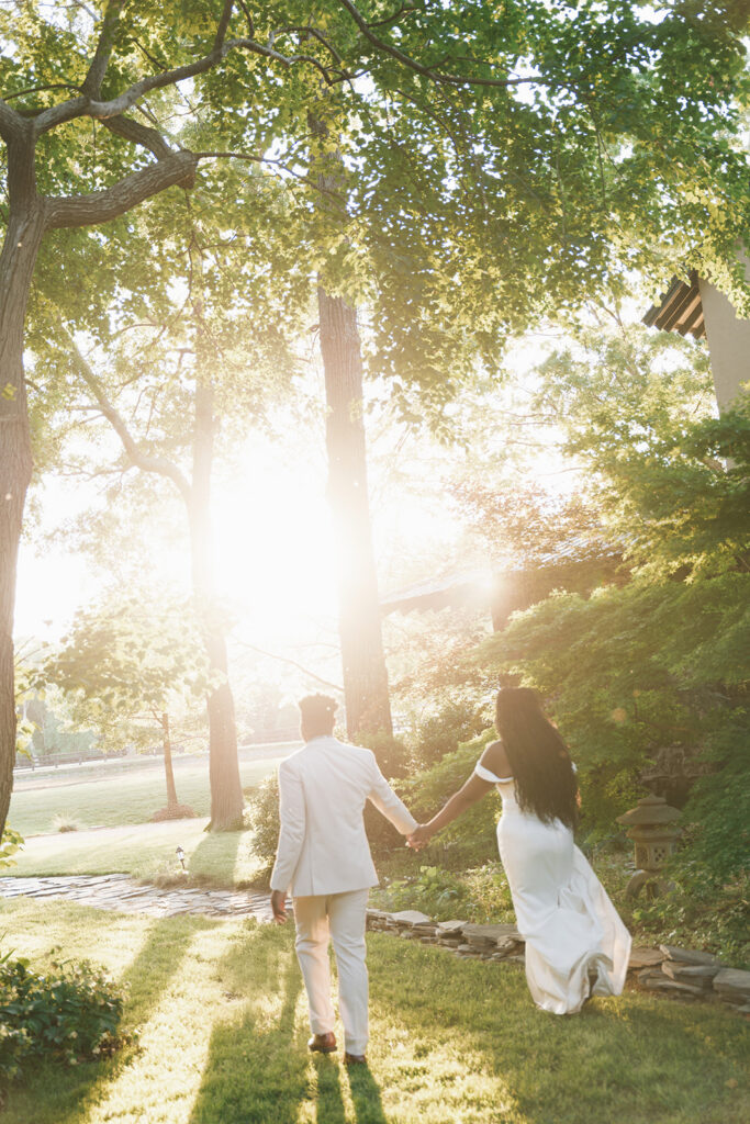 cute picture of the newlyweds holding hands during golden hour