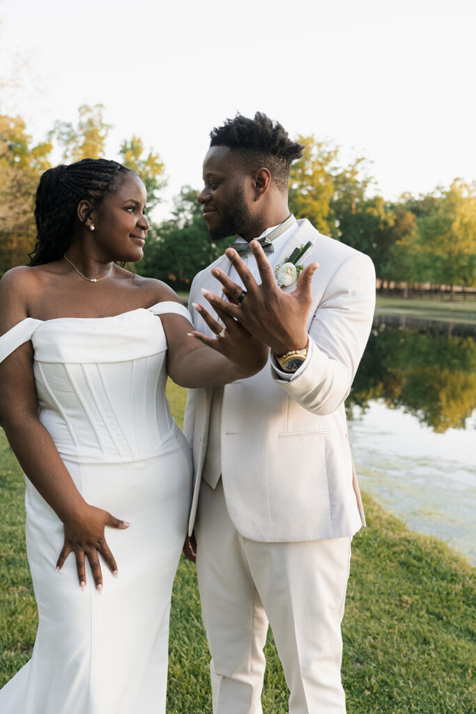 portrait of the bride and groom showing their wedding rings