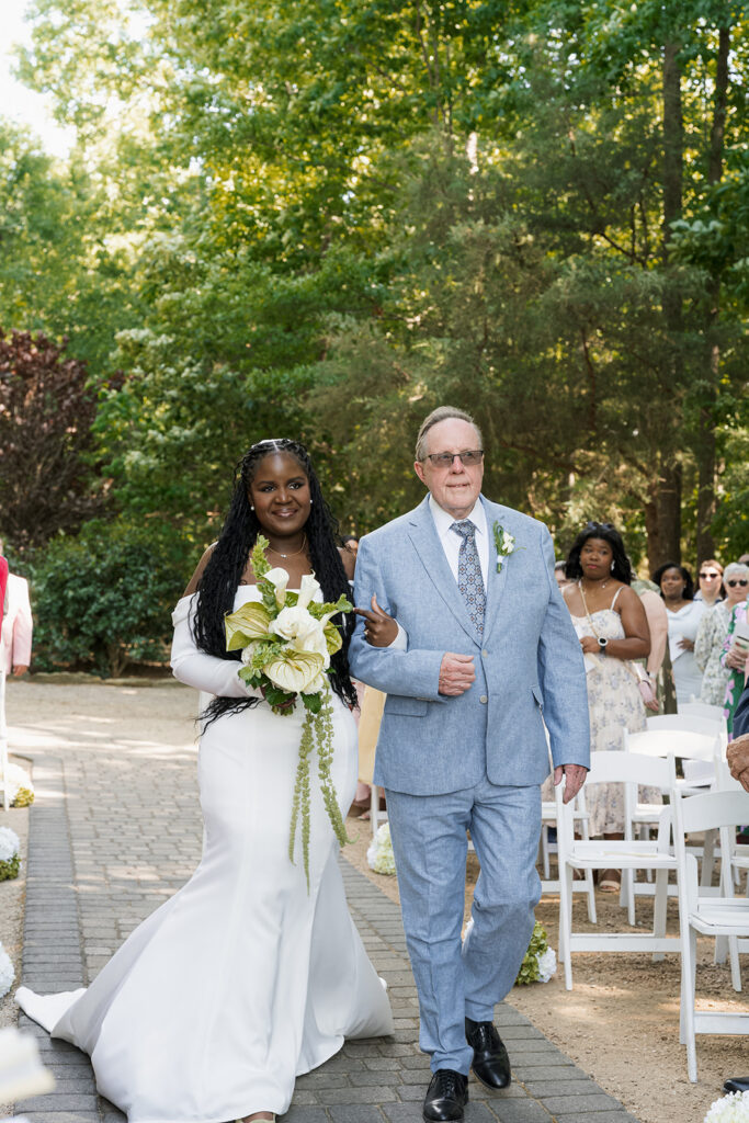 cute picture of the bride walking down the aisle