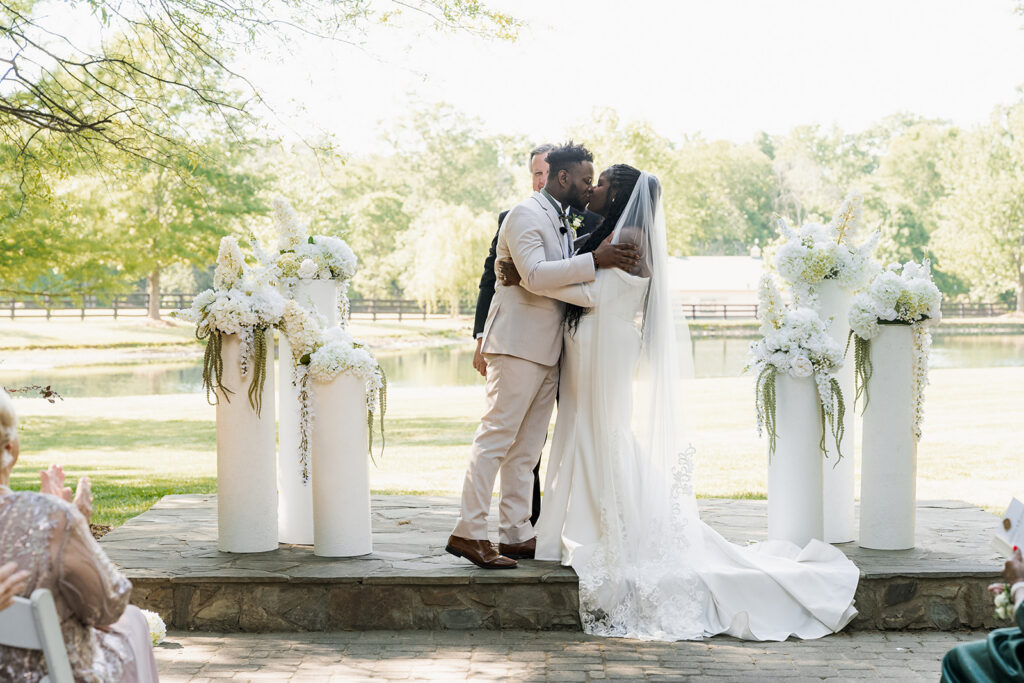 newlyweds kissing after their ceremony