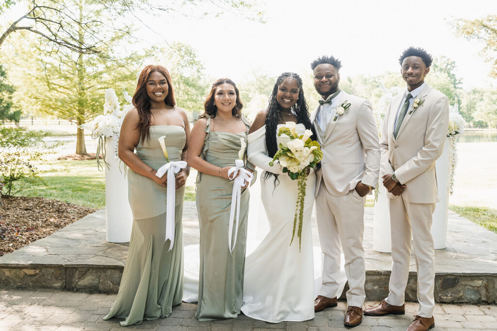 cute picture of the bride and groom with their bridal parties