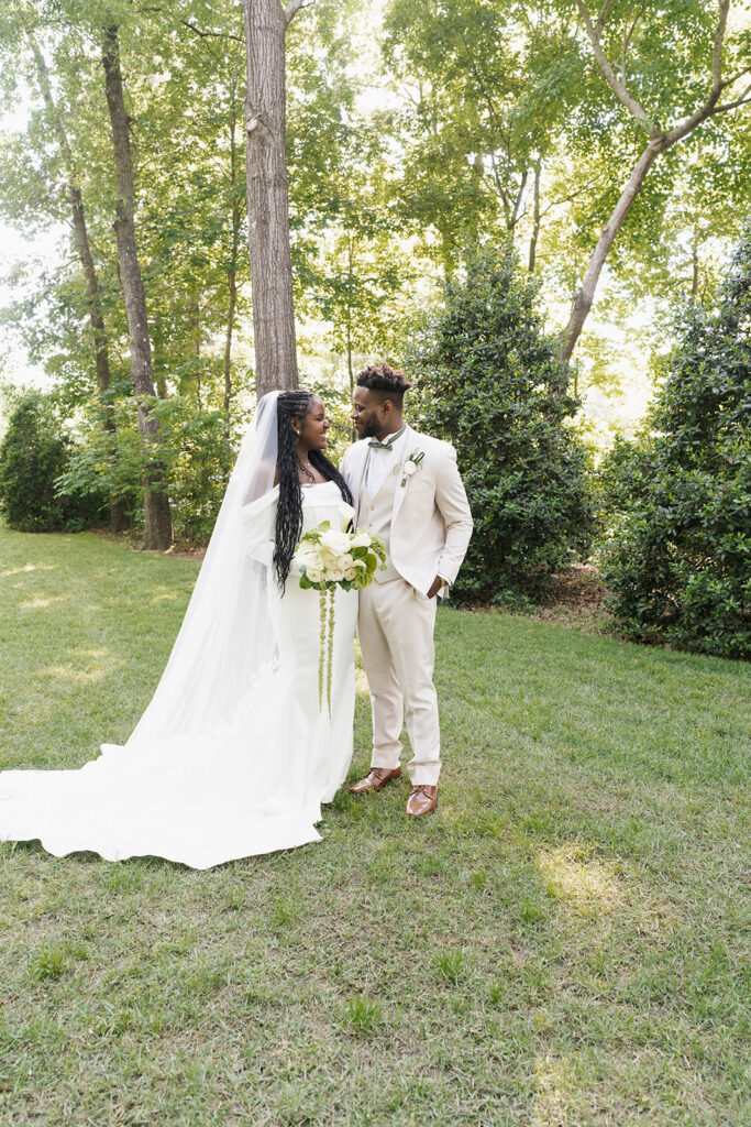 cute picture of the bride and groom smiling at each other