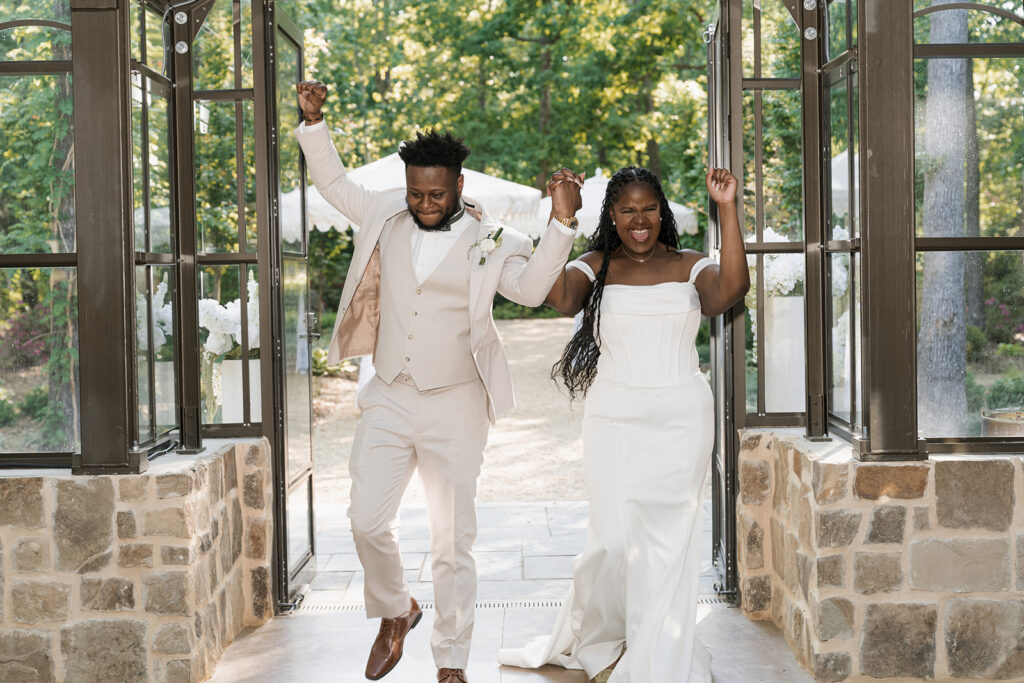 Newly married couple arriving at their wedding reception