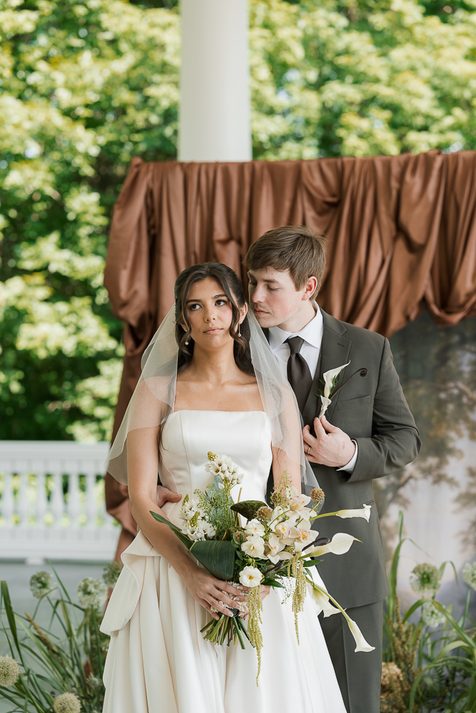 groom kissing the bride on the cheek