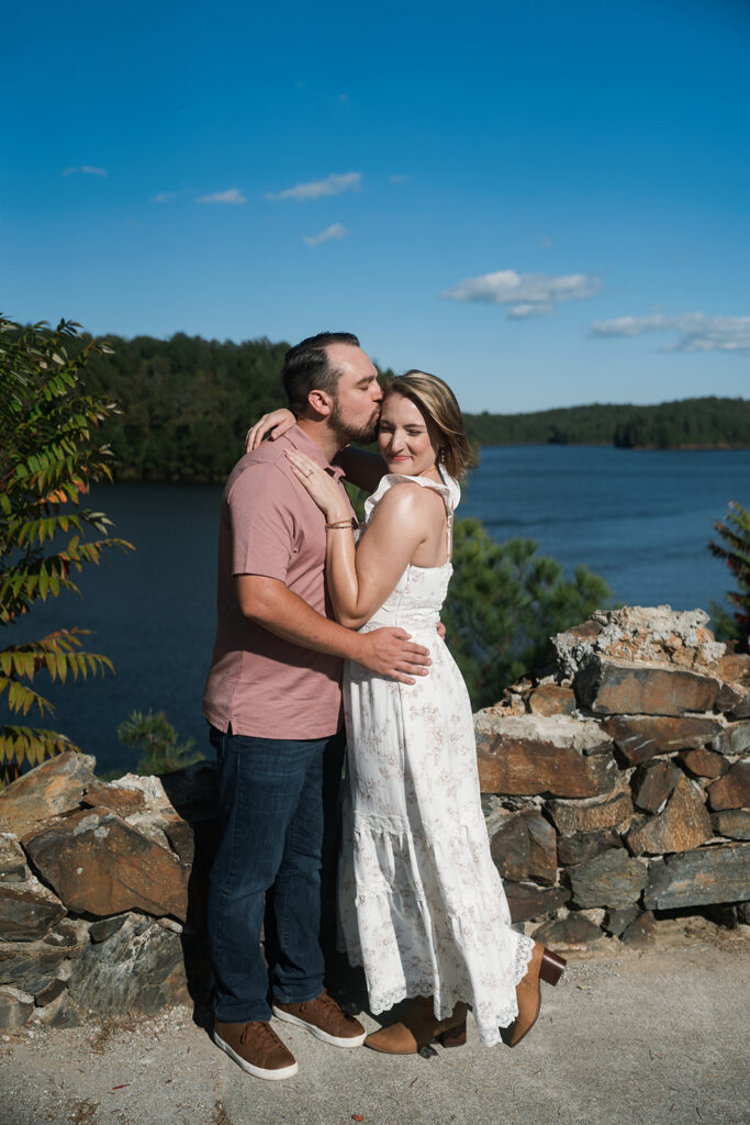 fiance kissing his fiance on the forehead