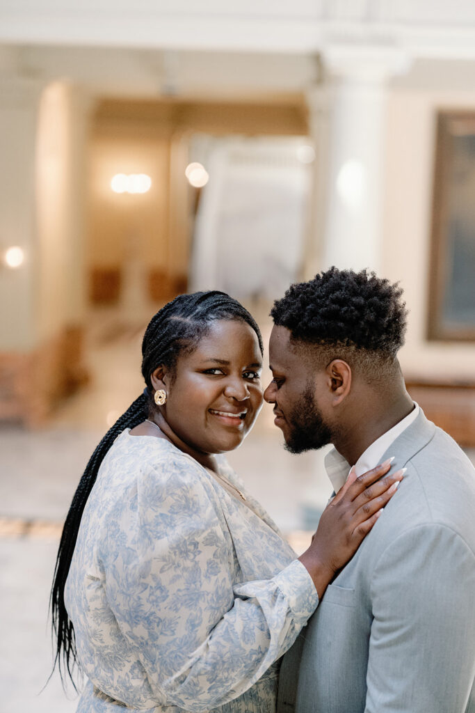 fiance kissing his fiance on the cheek